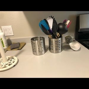 Two silver utensil holder